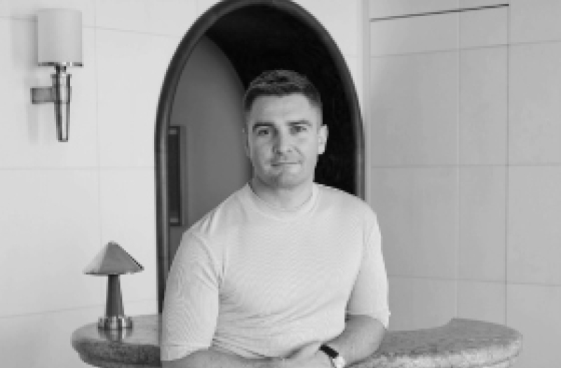 Bryan O'Sullivan leaning on a table