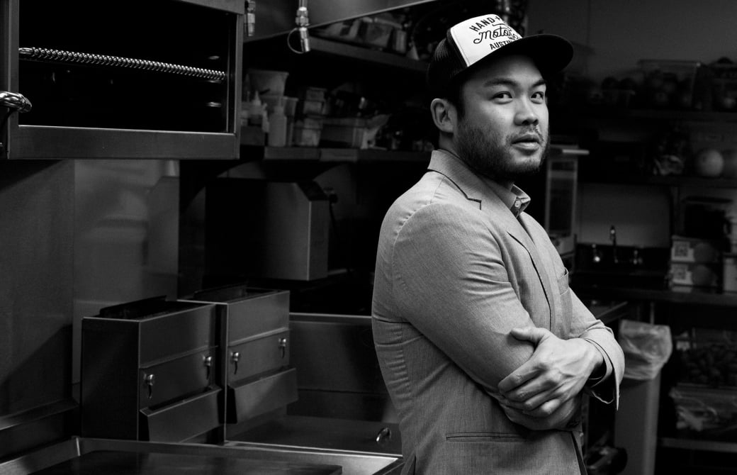 chef paul qui standing with arms crossed looking at camera