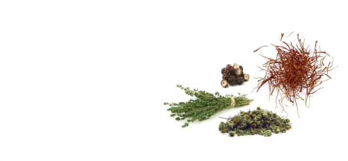 Four bundles of different dried herbs, plants, and flowers.